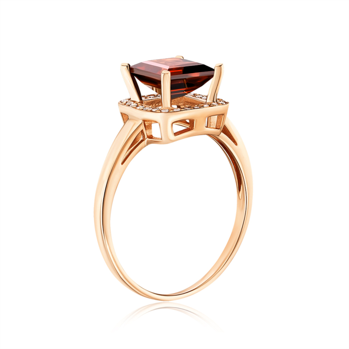 Золота каблучка з гранатом та фіанітами 530193/01/0/5146