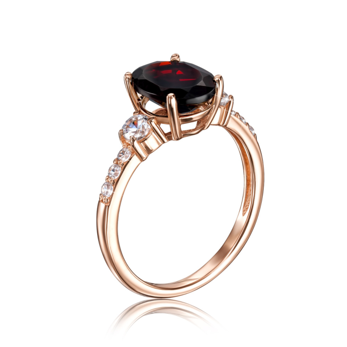 Золотое кольцо с гранатом и фианитами. Артикул 530269/01/0/6504