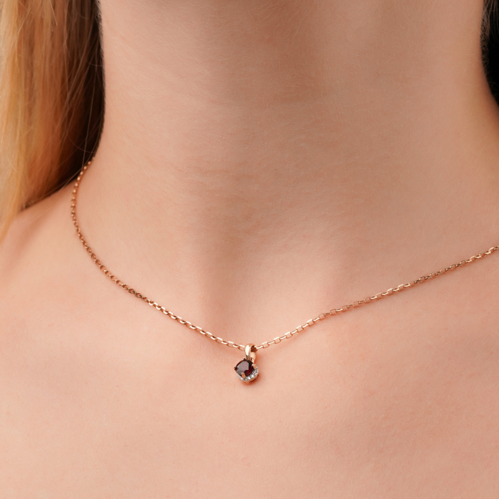 Золота підвіска з гранатом та фіанітами 550124/01/1/7906